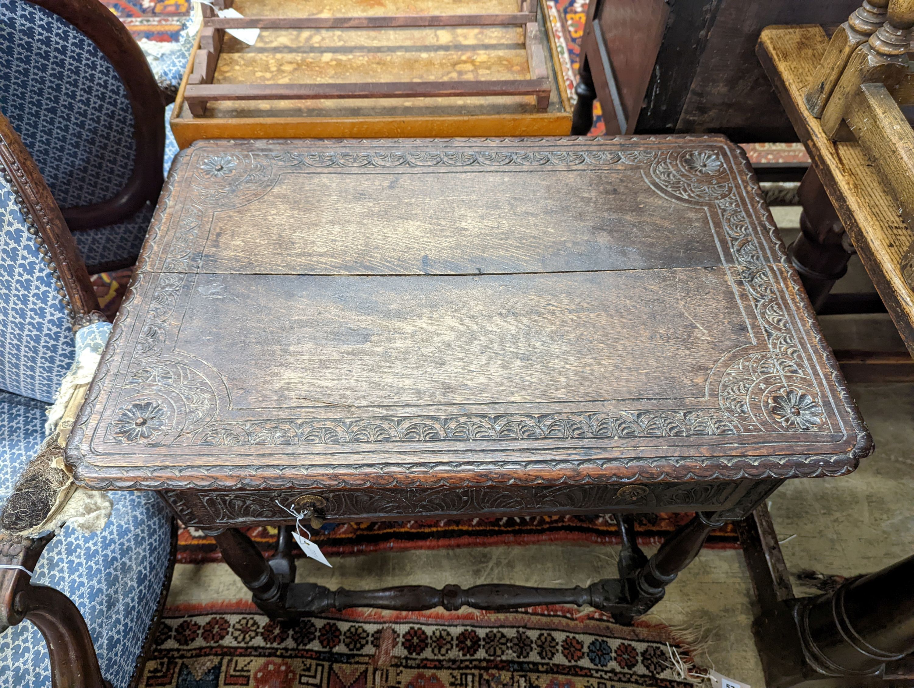 An 18th century carved oak side table, width 71cm, depth 47cm, height 67cm